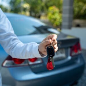 close up of person holding car keys