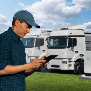 A fleet manager holding a tablet