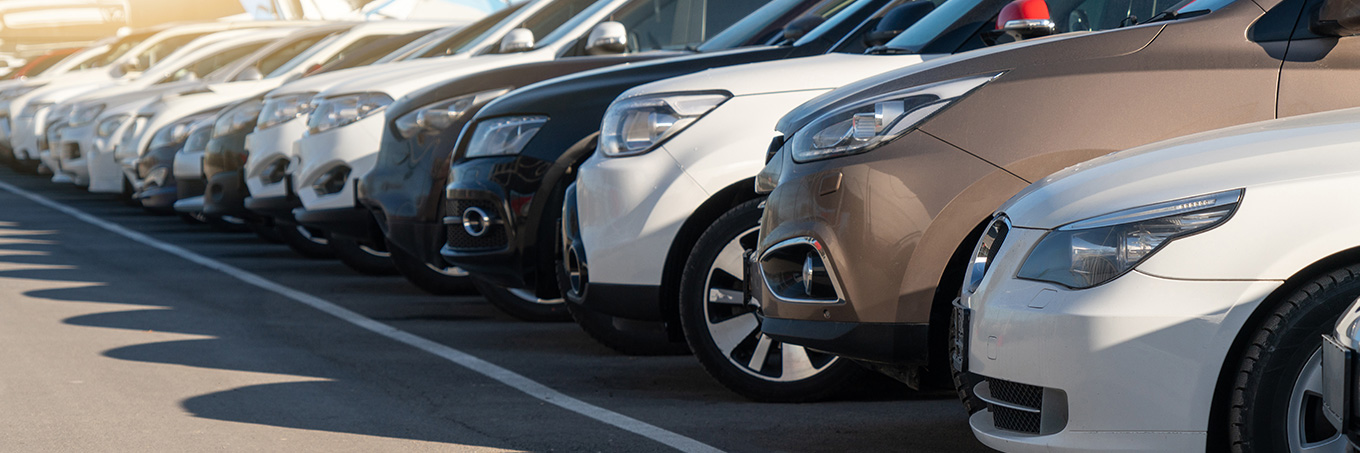 A row of crossover SUVS in a fleet parking lot