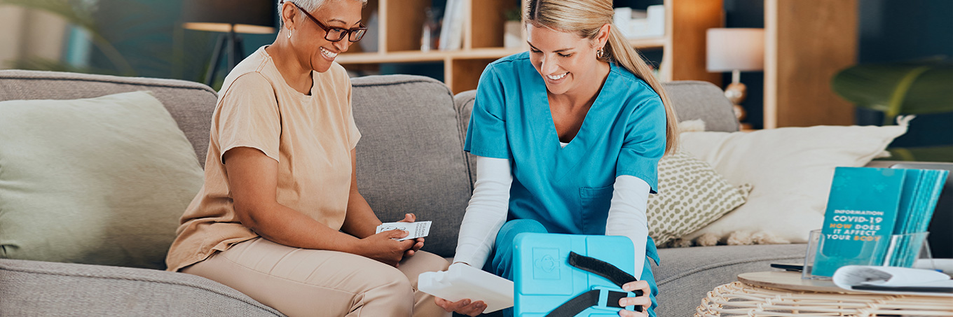 Doctor, senior woman and home with medicine, box or delivery via Pharmaceutical Transport