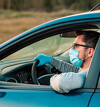 A man driving a sedan for secure pharmaceutical delivery